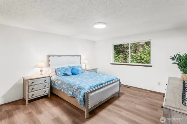 The primary suite window faces the back yard for quiet privacy.