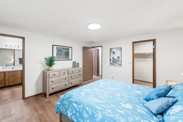 Primary suite with walk in closet is at the far end of the house for privacy.