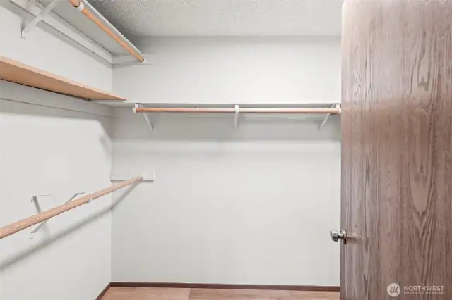 A walk-in closet in the primary suite.