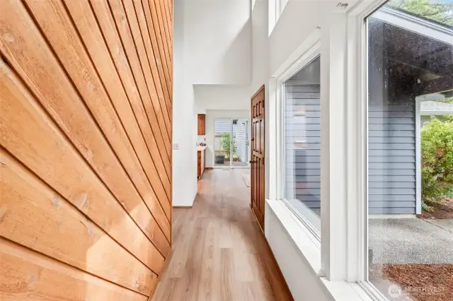Unique wood paneled wall in the entry and hallway.