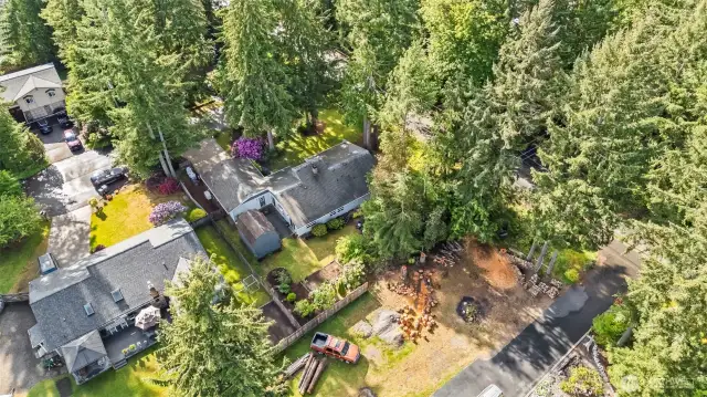 The aerial view shows the home with shed and garden in the back yard.