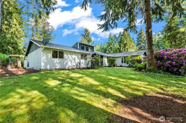 The home is on a spacious corner lot with walking distance to Banner Forest for hiking and biking.