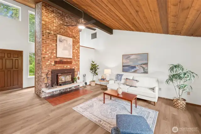 Large windows in the entryway give light and grandeur to the home.
