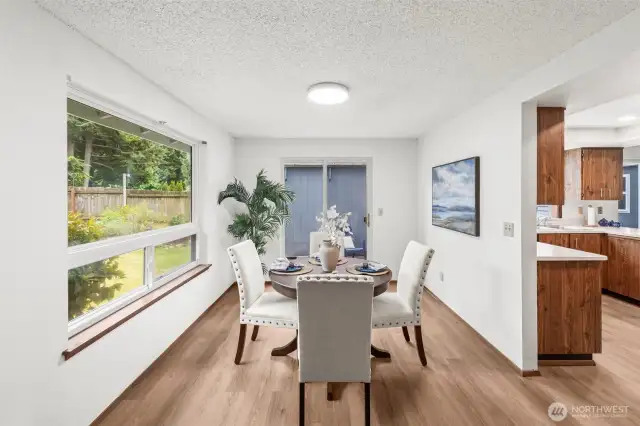 Formal dining room with slider to the back patio creates a lovely flow for entertaining.