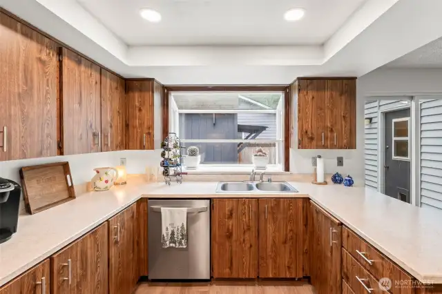Stainless appliances and updated countertops create a joyful cooking experience.