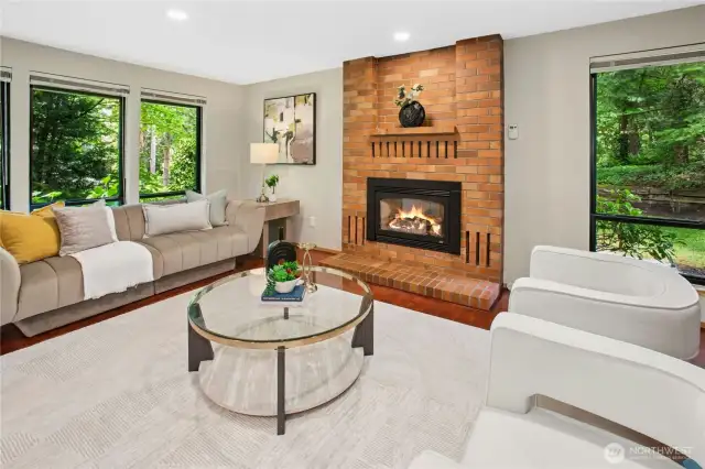 Spacious family room with updated hardwoods and a gas fireplace!