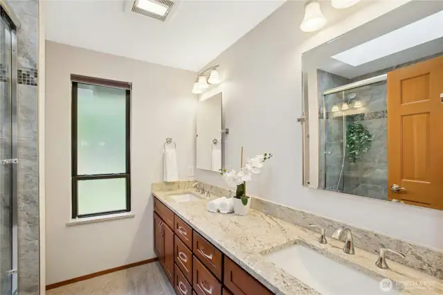 Large main bathroom w/ quartz countertops, undermount sinks, and heated floors!