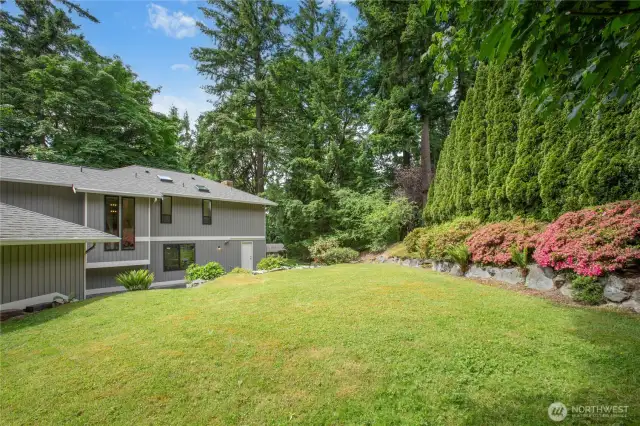 The backyard is terraced and features mature landscaping and an incredible show of color in the spring!
