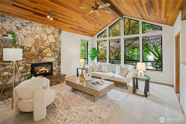 Large vaulted living room with picture windows offer Lake Sammamish views