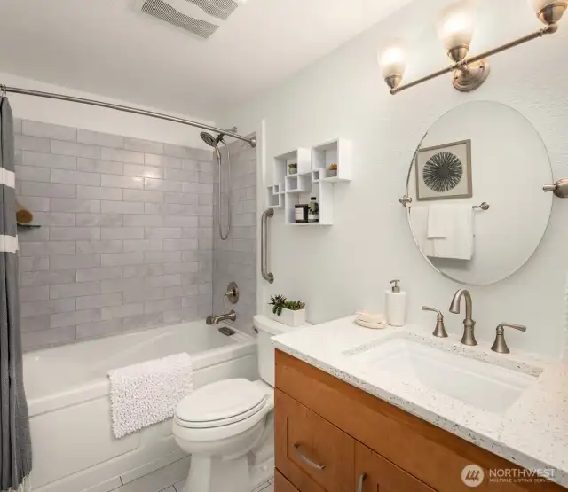 Updated full bath with soaker tub.