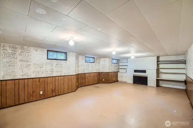 Spacious basement with masonry fireplace