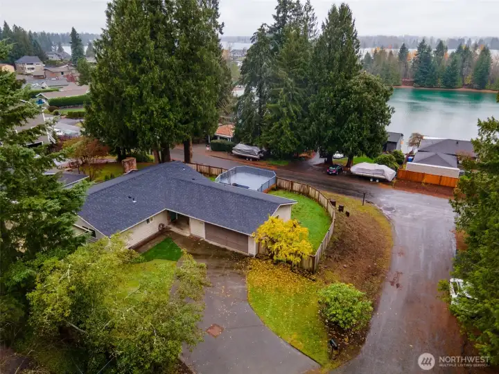 Welcome to this lovely home sitting on an elevated corner lot with panoramic views of Lake Tapps, nestled among a serene and peaceful neighborhood.