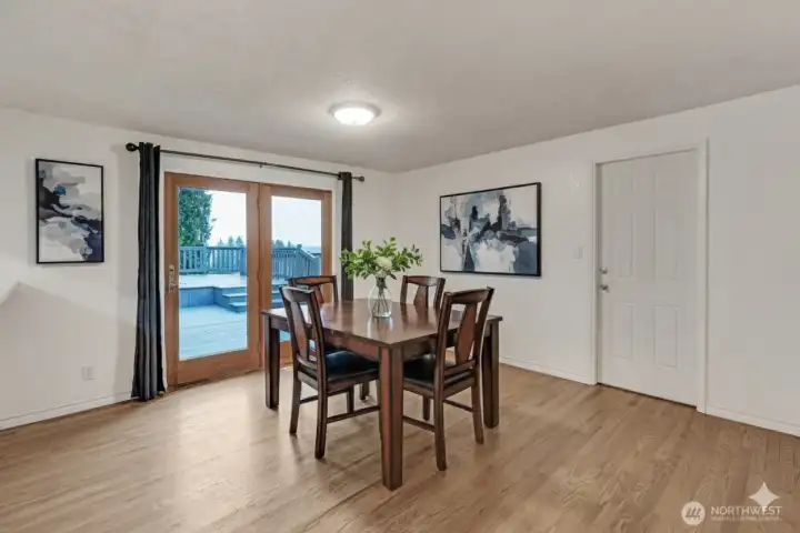 Spacious dining area has a beautiful access door to the deck extending your entertainment space to the outdoors.