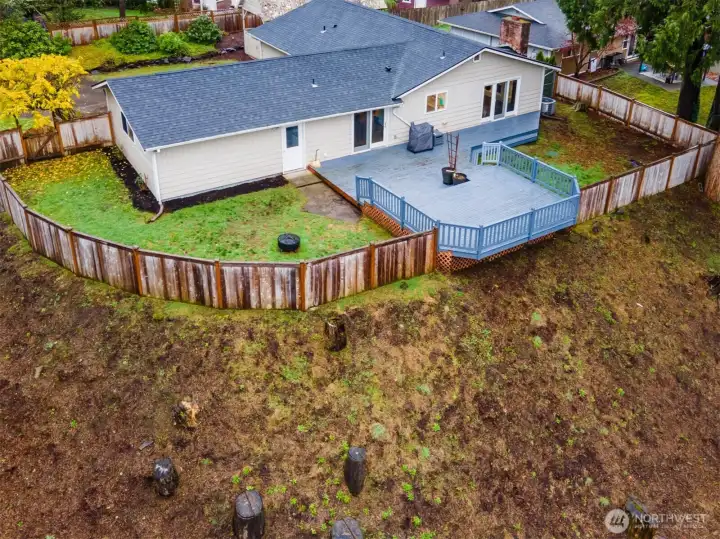 Massive entertainment size deck will host summer fun BBQs with family and friends. Backyard is fully fenced conveniently keeping pets and little ones safe at play.