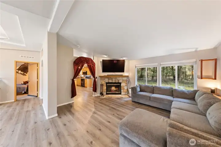 Open and bright living room that flows into kitchen and dining