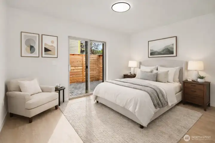 Virtual Staging - First floor bedroom boasts loads of natural light and access to private patio