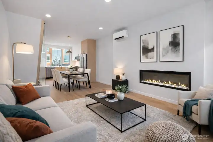 Virtual staging - great sized living room with cozy fireplace and ample room for dining table