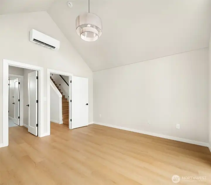 beautiful primary suite with vaulted ceilings