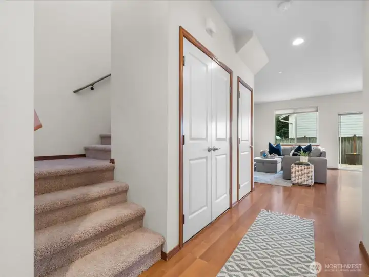 Entry foyer with stairs leading to all upstairs bedrooms - notice brand new carpet from the stairs up