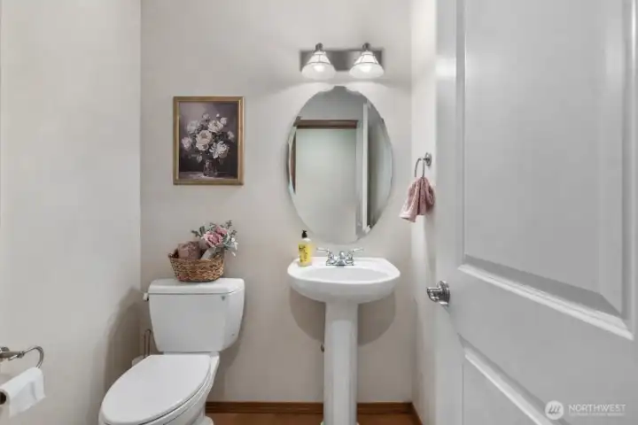 Main-level powder room—perfectly positioned for guest convenience.
