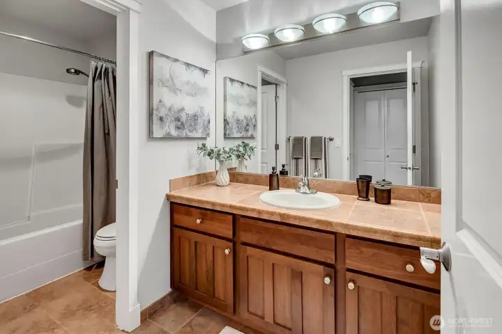 Upper full bath with new sink and faucet
