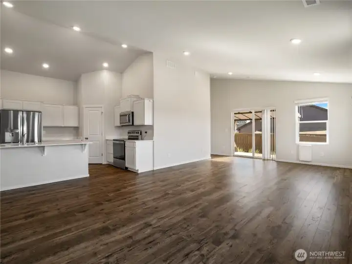 Vaulted ceilings make this space feel spacious and the abundant natural light makes it feel light and bright and yet still warm and cozy.