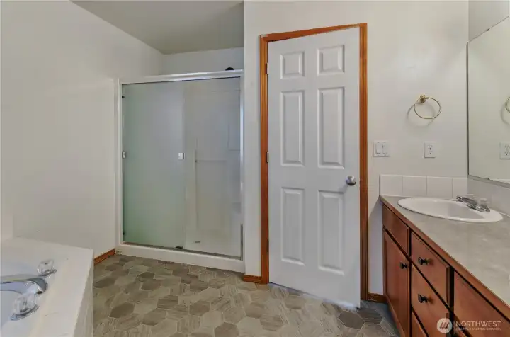 Soaking tub, double vanity, newer floor in here, too!