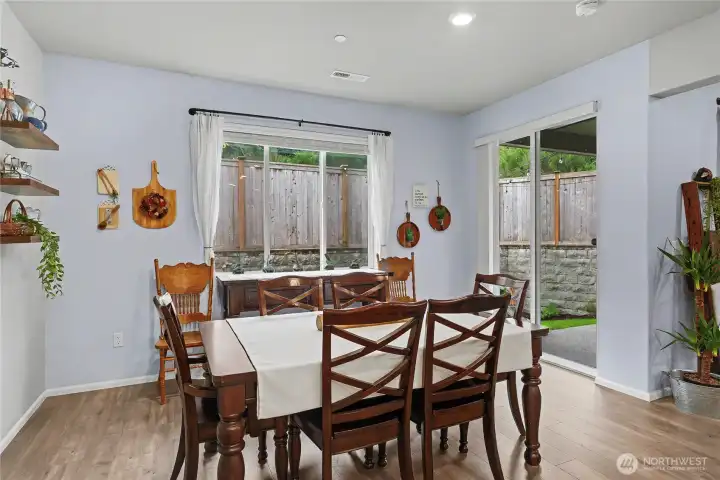 Dining nook off the kitchen. Sliding glass doors open to the private back yard.