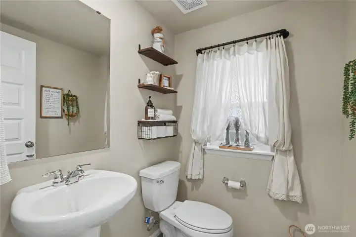 Half bath at the base of the stairs.