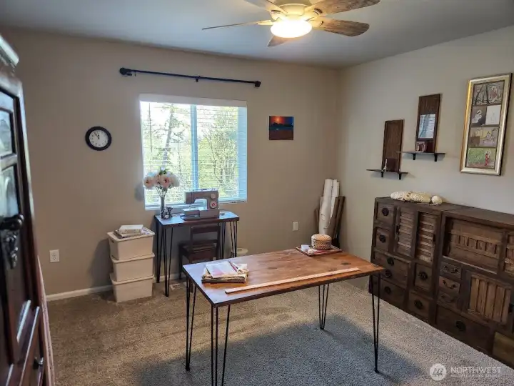 Fourth bedroom is used as a sewing room.