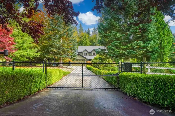 Gated, secure entry & paved driveway