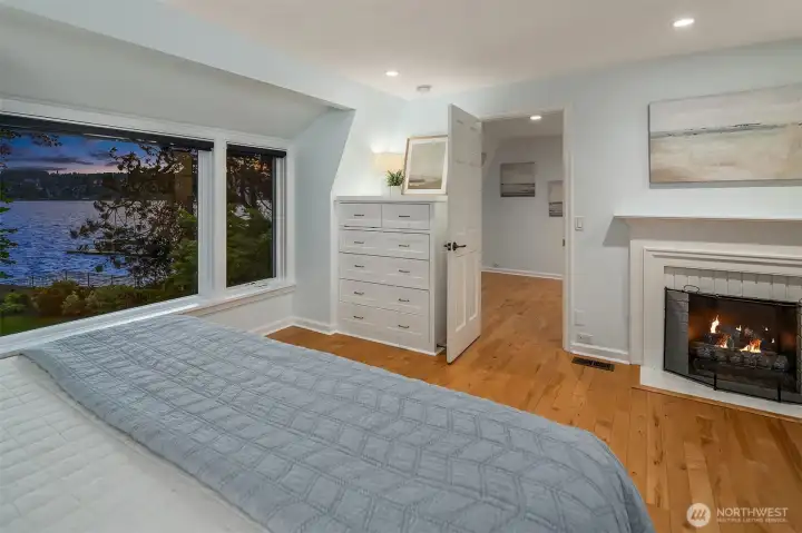 another view from the bed of the lake and fireplace.
