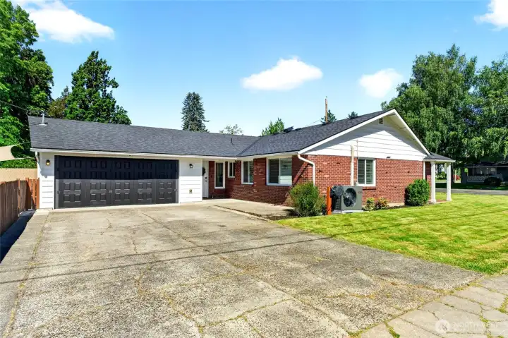 Corner lot with side entrance off of 16th, includes a spacious driveway with room up to 6 hours + street parking.