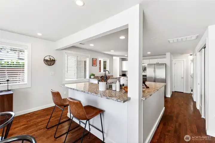 Spacious kitchen with counter seating.