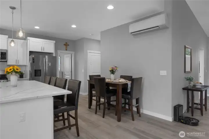 Share meals and conversation in an open dining space connected to the heart of the home.