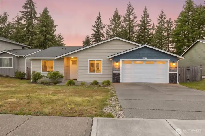 Come home to a welcoming rambler with beautiful twilight curb appeal in Trotter Downs.