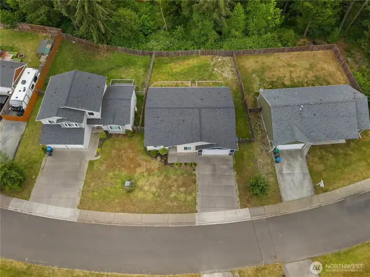 Appreciate the generous lot size and quiet neighborhood setting from this full aerial perspective.