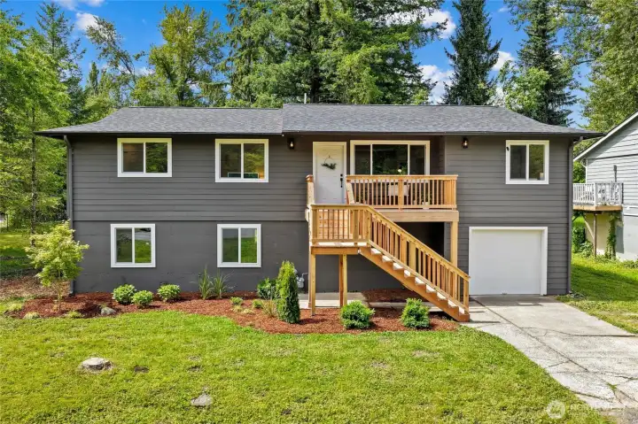 Front of home, fully remodeled - new front deck, new siding, new roof, new windows Front of home, fully remodeled - new front deck, new siding, new roof, new windows
