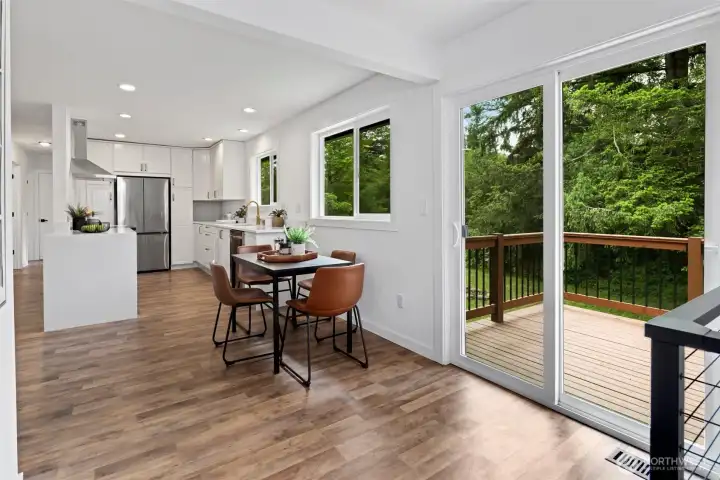 Eat-in Kitchen space and open concept main living with slider to back patio for seamless outdoor entertaining Eat-in Kitchen space and open concept main living with slider to back patio for seamless outdoor entertaining
