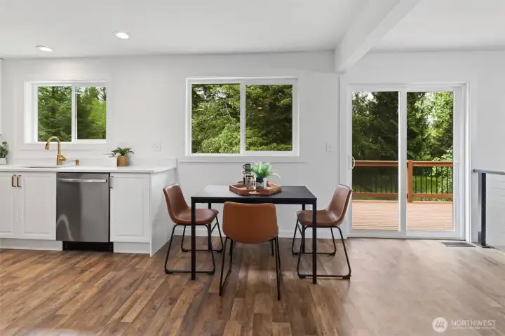 Eat-in Kitchen space and open concept main living with slider to back patio for seamless outdoor entertaining Eat-in Kitchen space and open concept main living with slider to back patio for seamless outdoor entertaining