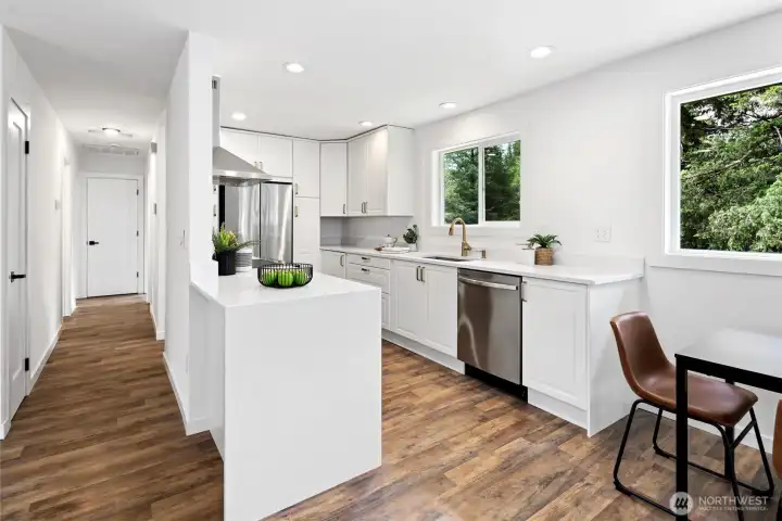 Fully remodeled kitchen with quartz counters, stainless steel wifi enabled appliances and curated designer details Fully remodeled kitchen with quartz counters, stainless steel wifi enabled appliances and curated designer details