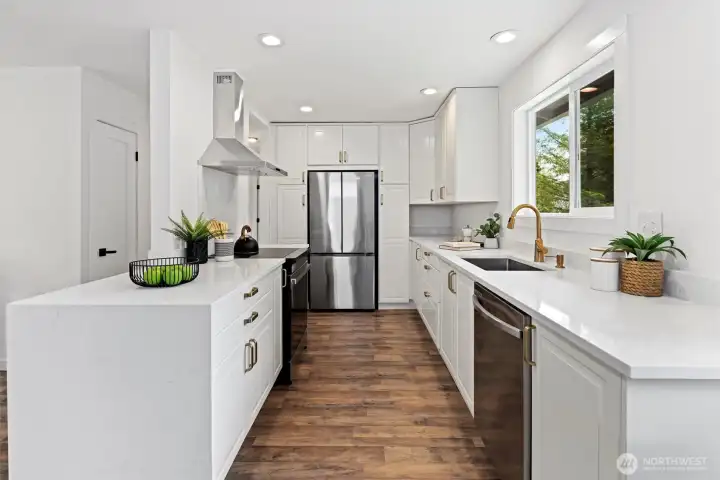 Fully remodeled kitchen with quartz counters, stainless steel wifi enabled appliances and curated designer details Fully remodeled kitchen with quartz counters, stainless steel wifi enabled appliances and curated designer details