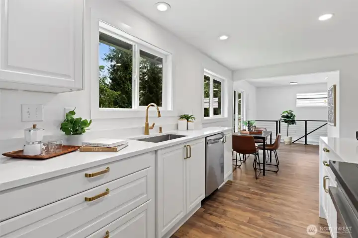 Fully remodeled kitchen with quartz counters, stainless steel wifi enabled appliances and curated designer details Fully remodeled kitchen with quartz counters, stainless steel wifi enabled appliances and curated designer details