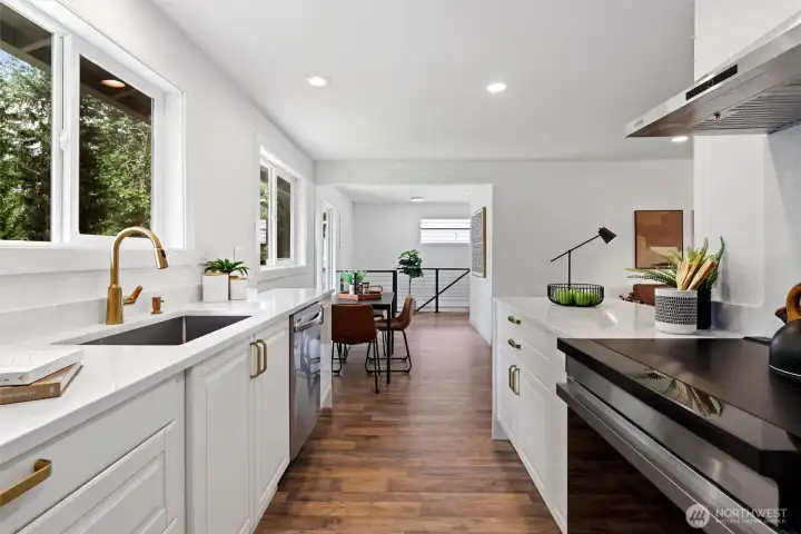 Fully remodeled kitchen with quartz counters, stainless steel wifi enabled appliances and curated designer details Fully remodeled kitchen with quartz counters, stainless steel wifi enabled appliances and curated designer details