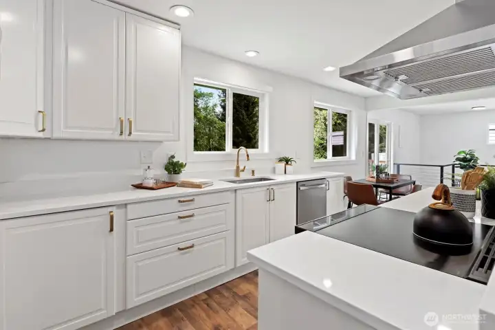 Fully remodeled kitchen with quartz counters, stainless steel wifi enabled appliances and curated designer details Fully remodeled kitchen with quartz counters, stainless steel wifi enabled appliances and curated designer details