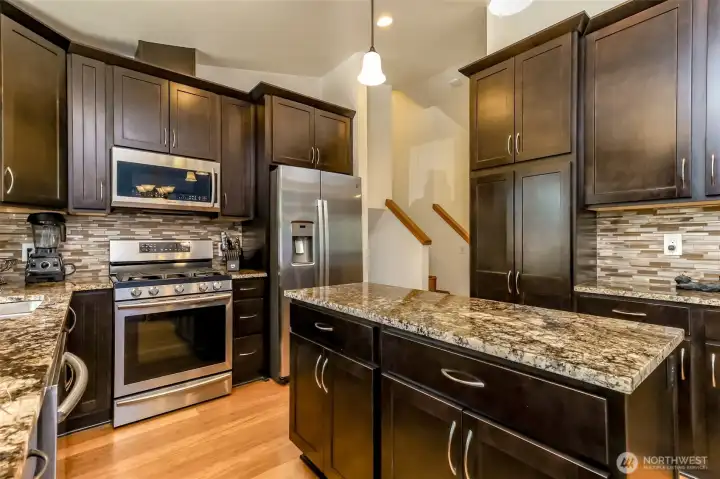 Beautiful updated kitchen with real maple wood cabinets and Brazillian Granite
