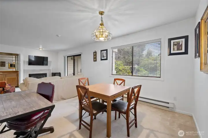 The open-concept layout seamlessly connects the living room and dining area. The open-concept layout seamlessly connects the living room and dining area.
