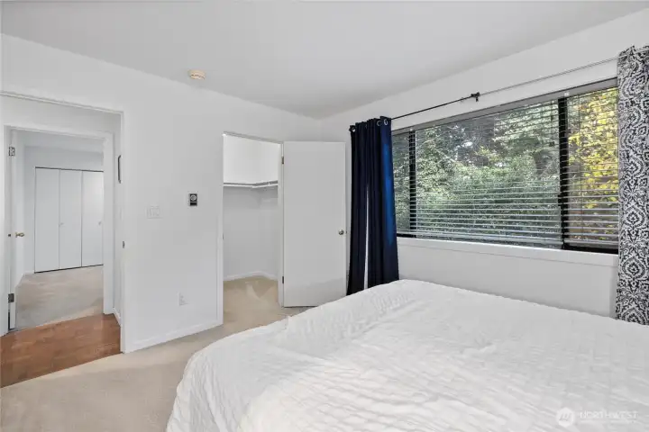Primary bedroom featuring a walk-in closet. Primary bedroom featuring a walk-in closet.