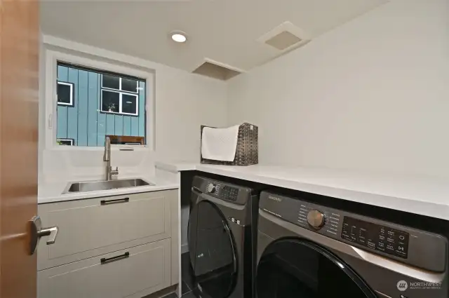 Laundry room is also on the main and there's a laundry chute from the Primary.