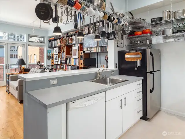 The kitchen is open to the main living area so the cook is not isolated.  It gets lots of light from the wall of windows as well as a skylight.